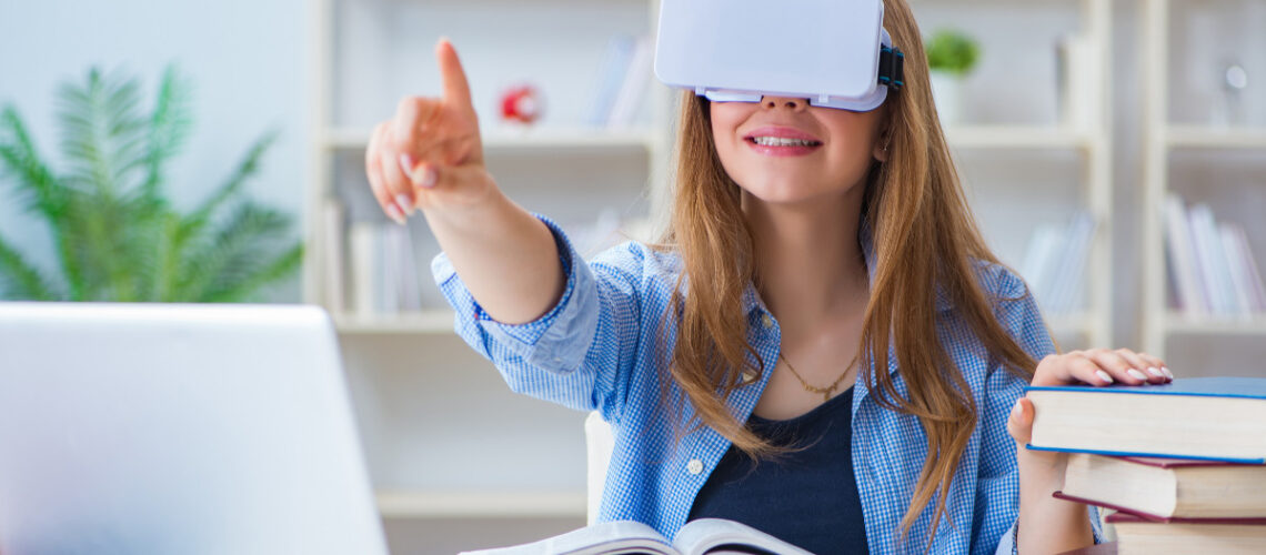 young girl wearing AR headset in a school setting with books and laptop