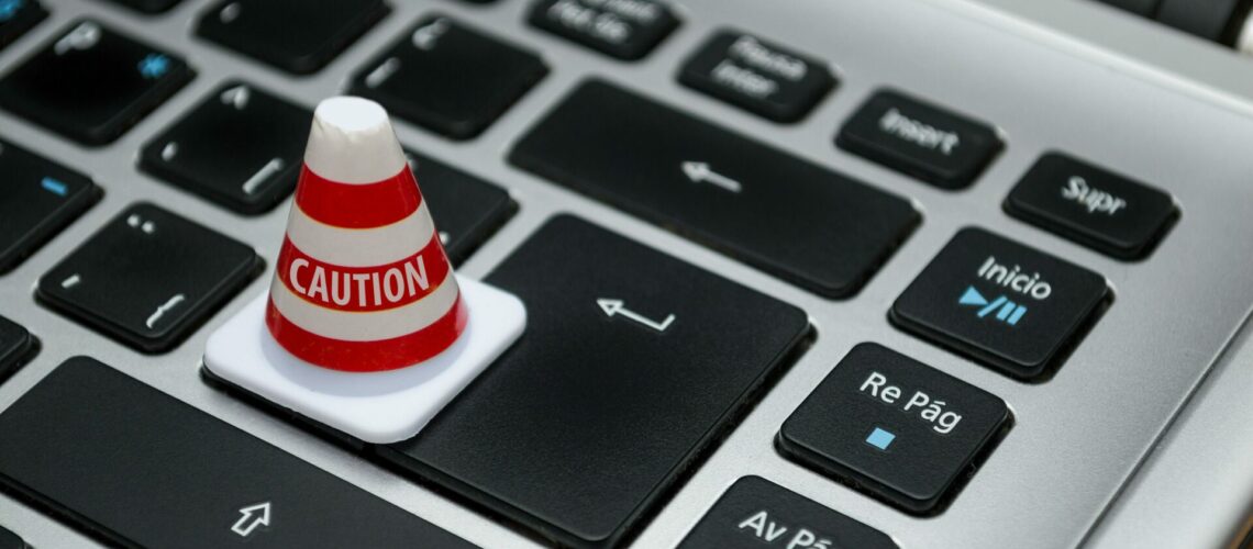 keyboard with a caution cone on it.